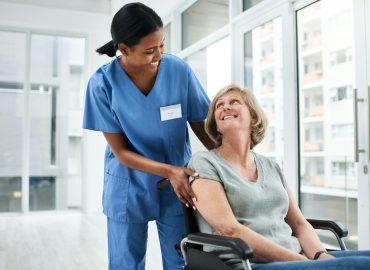 I feel right at home here. Shot of a young nurse caring for a senior woman in a wheelchair.
